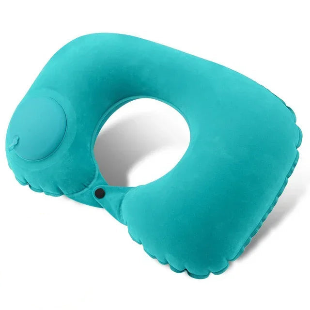 Turquoise inflatable neck pillow with malachite green flocking fabric on a white background